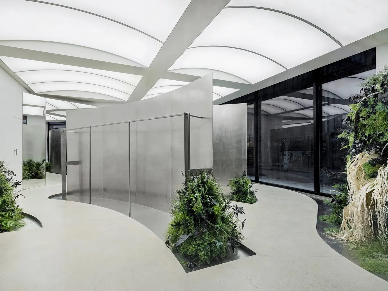 Modern interior space with concrete walls and glass features