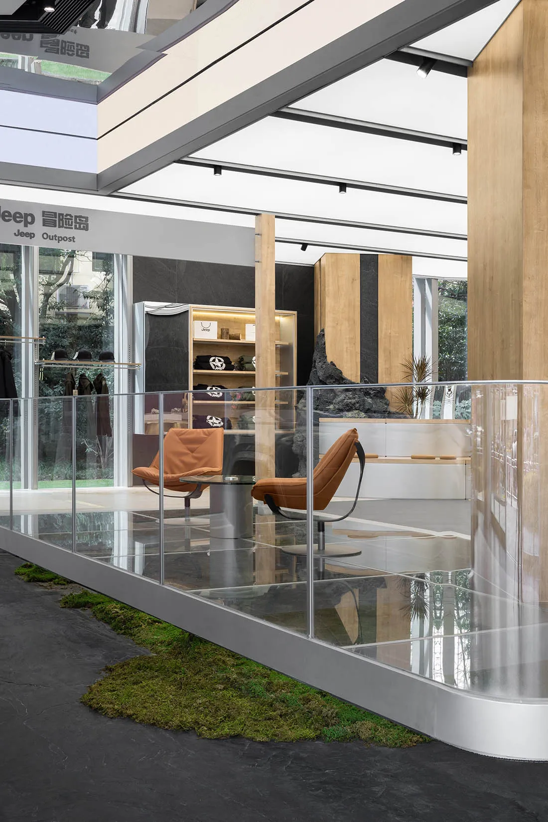 A modern retail storefront featuring glass, wood, and concrete materials.