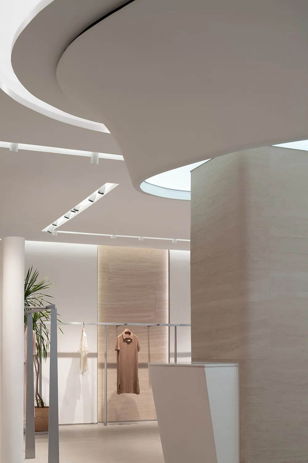 Modern retail store interior with neutral-toned materials and minimalist design.