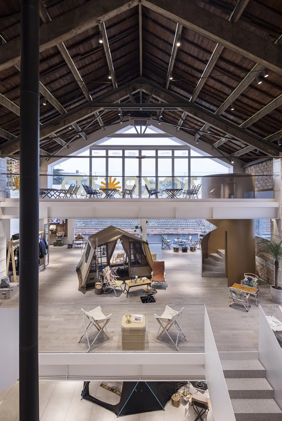 An industrial-style retail store with steel and concrete elements.