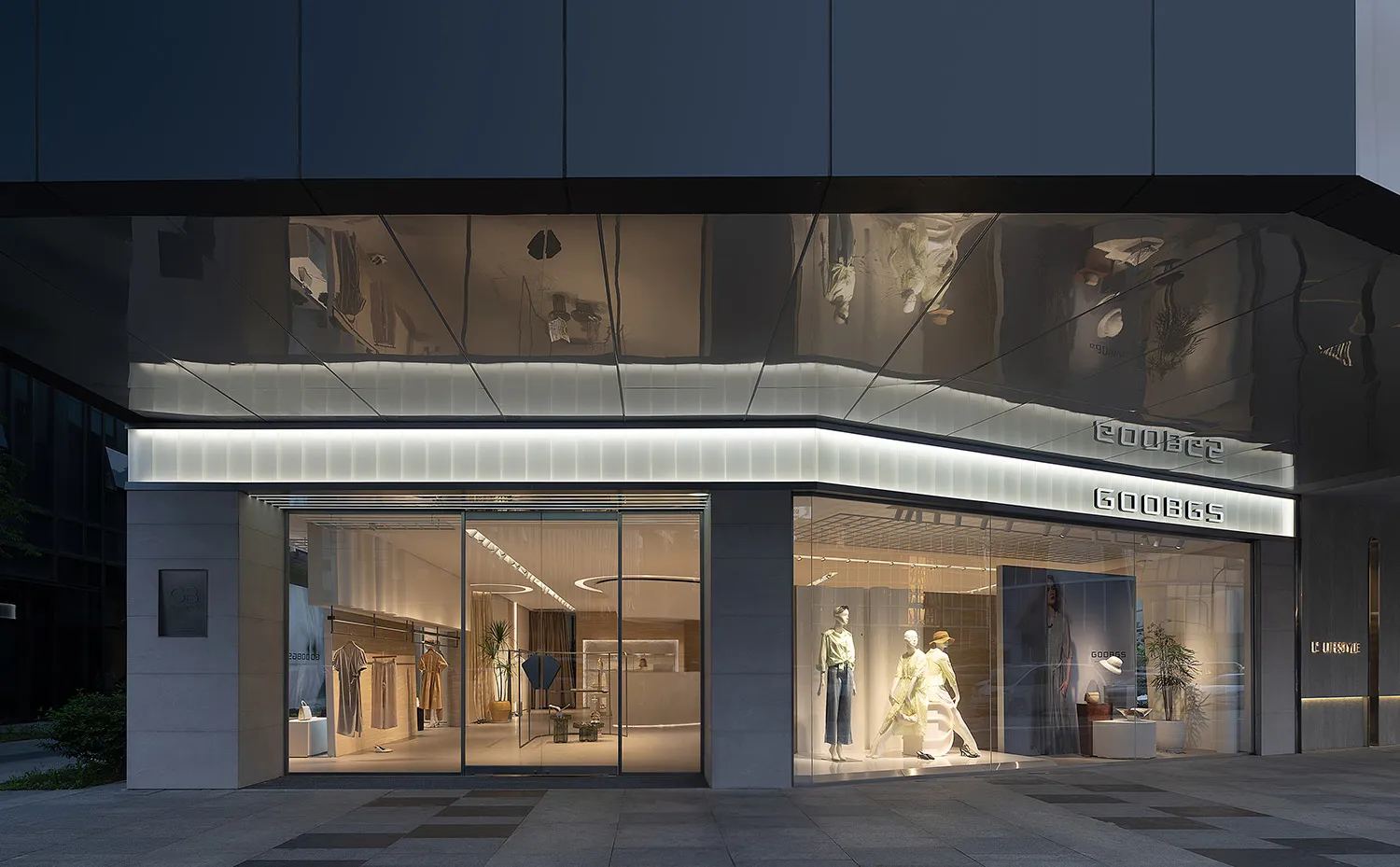 Modern retail storefront with glass facade, showcasing minimalist aesthetic.