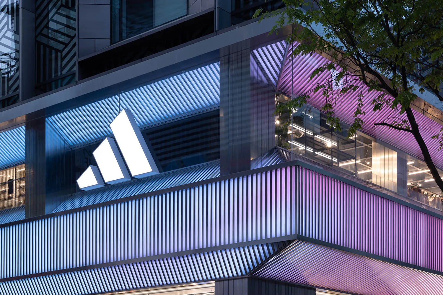 Modern metal architecture featuring vertical lines and angular shapes resembling a wave