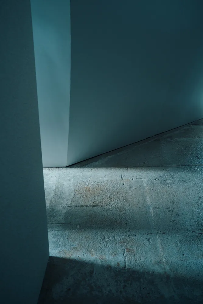 A modern concrete stairwell interior with minimalistic design.