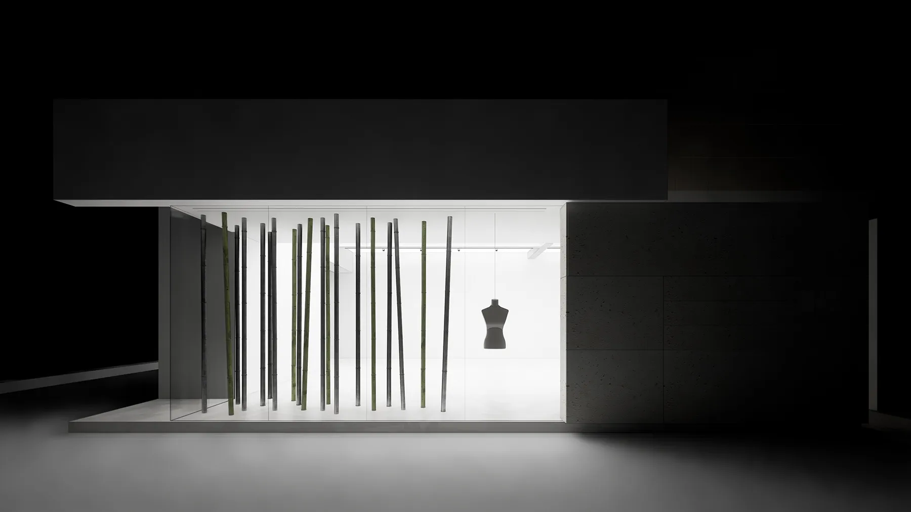A minimalist exhibition space featuring glass and metal materials.