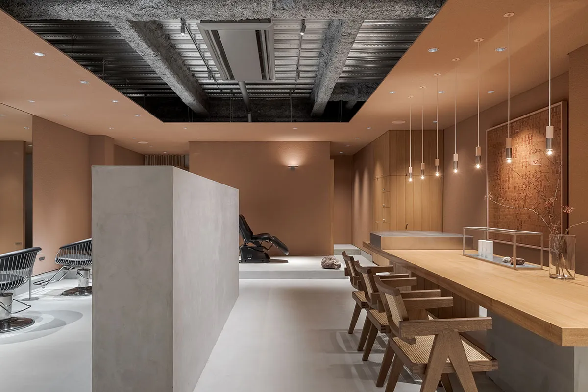 A minimalist spa interior with concrete walls and a modern design
