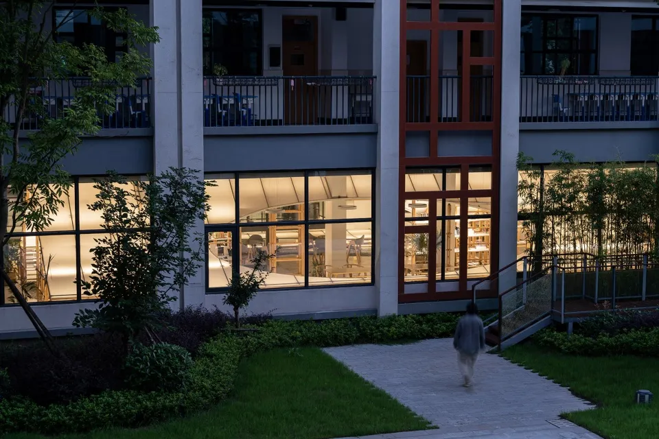 A modern retail storefront with glass walls and marble accents.