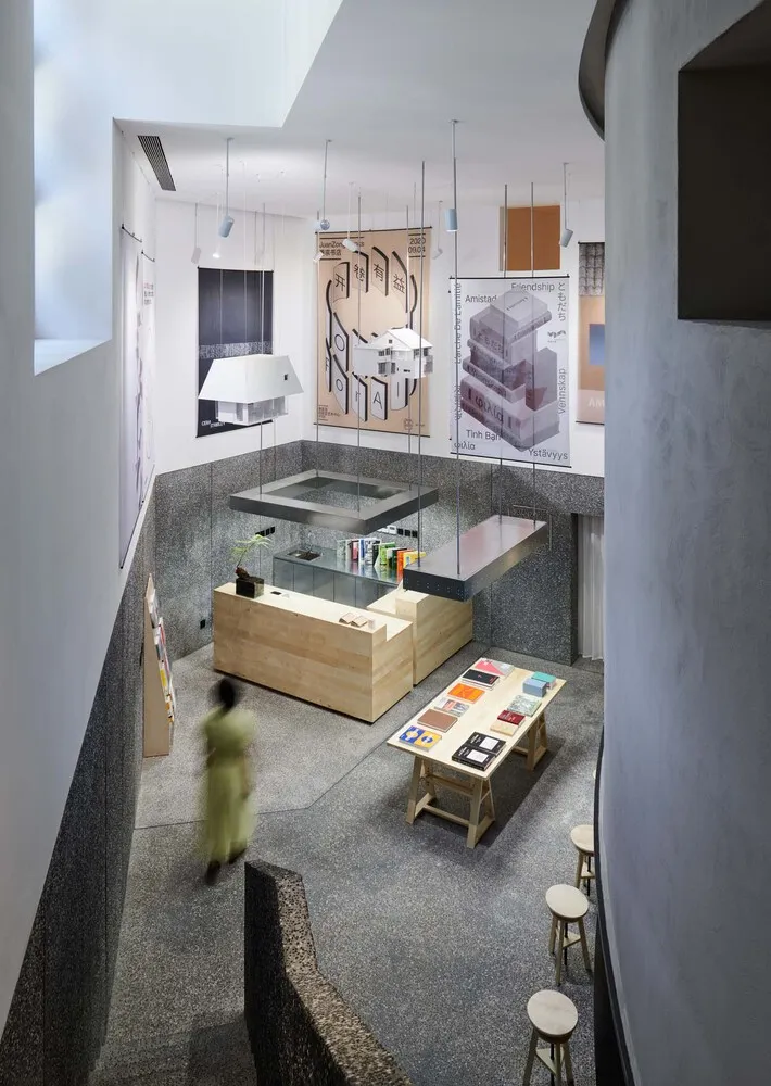 A modern retail shop with a glass countertop, featuring an open space layout and minimalist design.