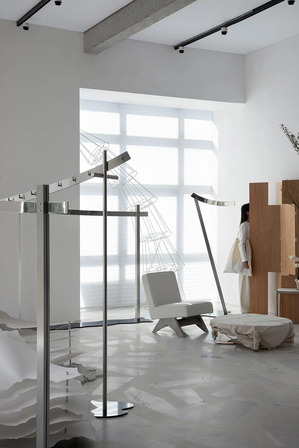 Interior design featuring modern elements of metal, wood, and glass.
