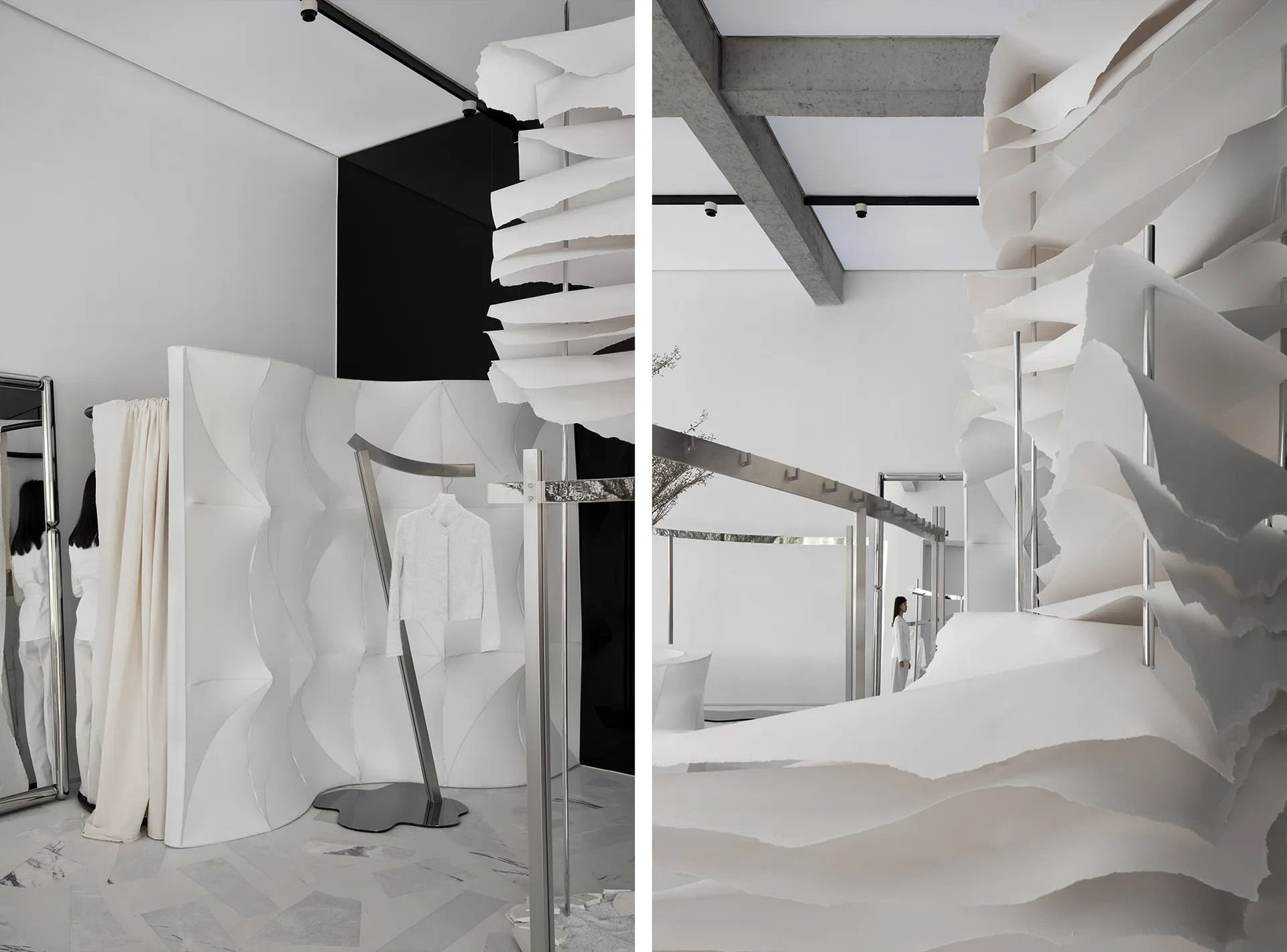 Modern minimalist fashion retail store featuring paper textiles and concrete architectural elements.