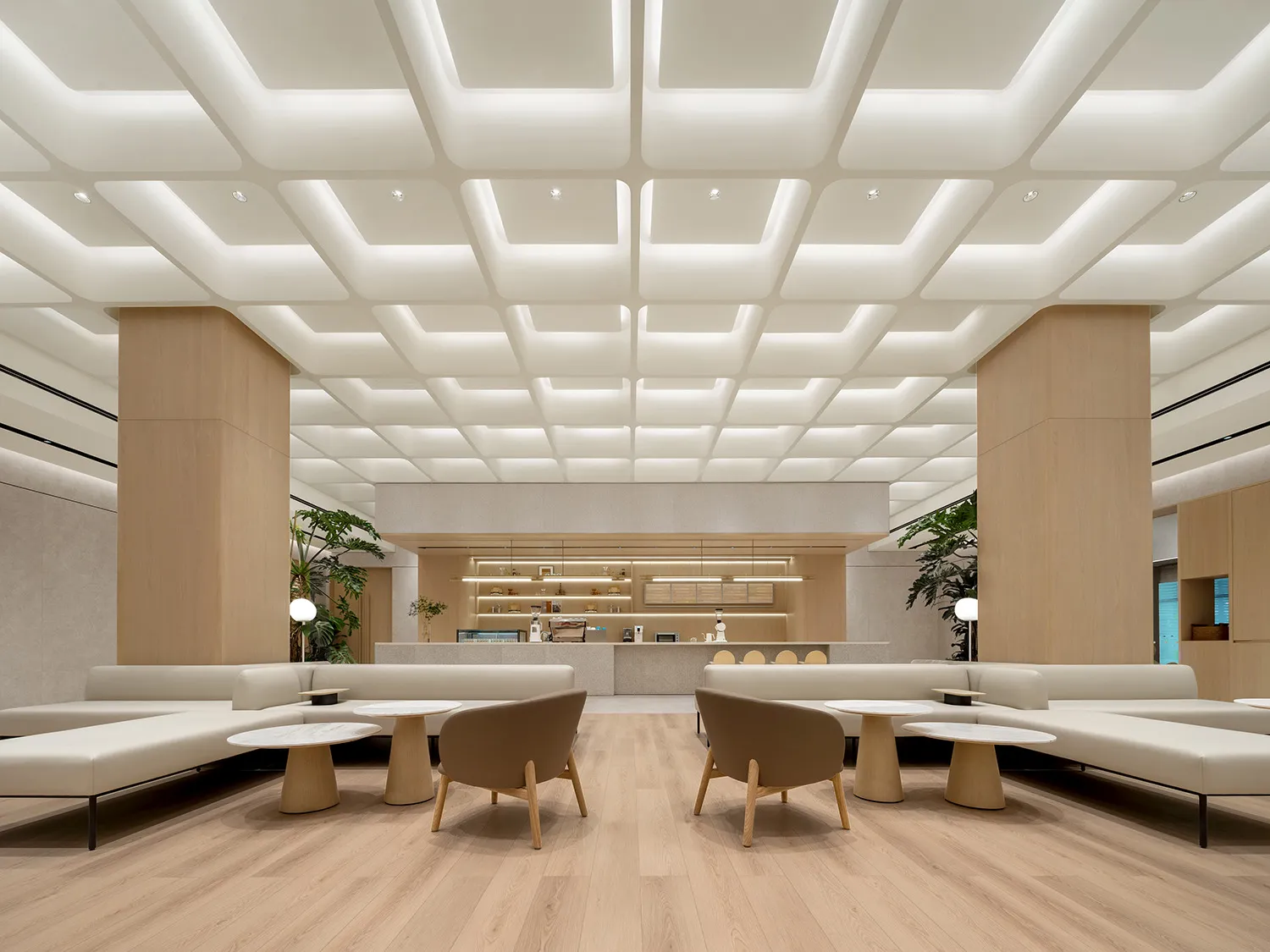Modern minimalist coffee shop featuring marble and wooden elements.