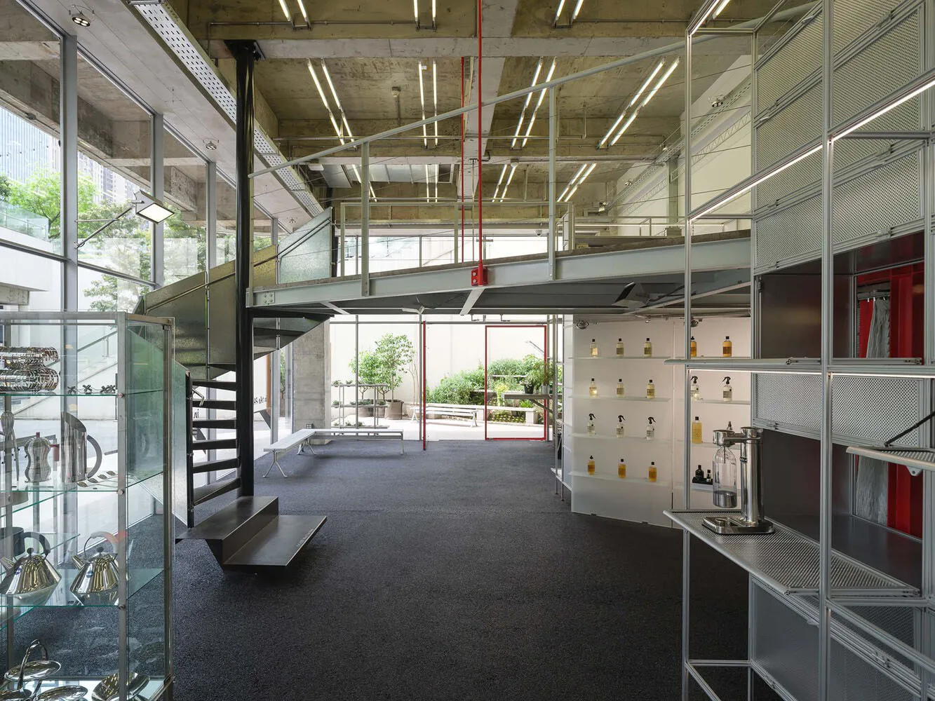 Industrial retail shop with metal frame and glass display cases.