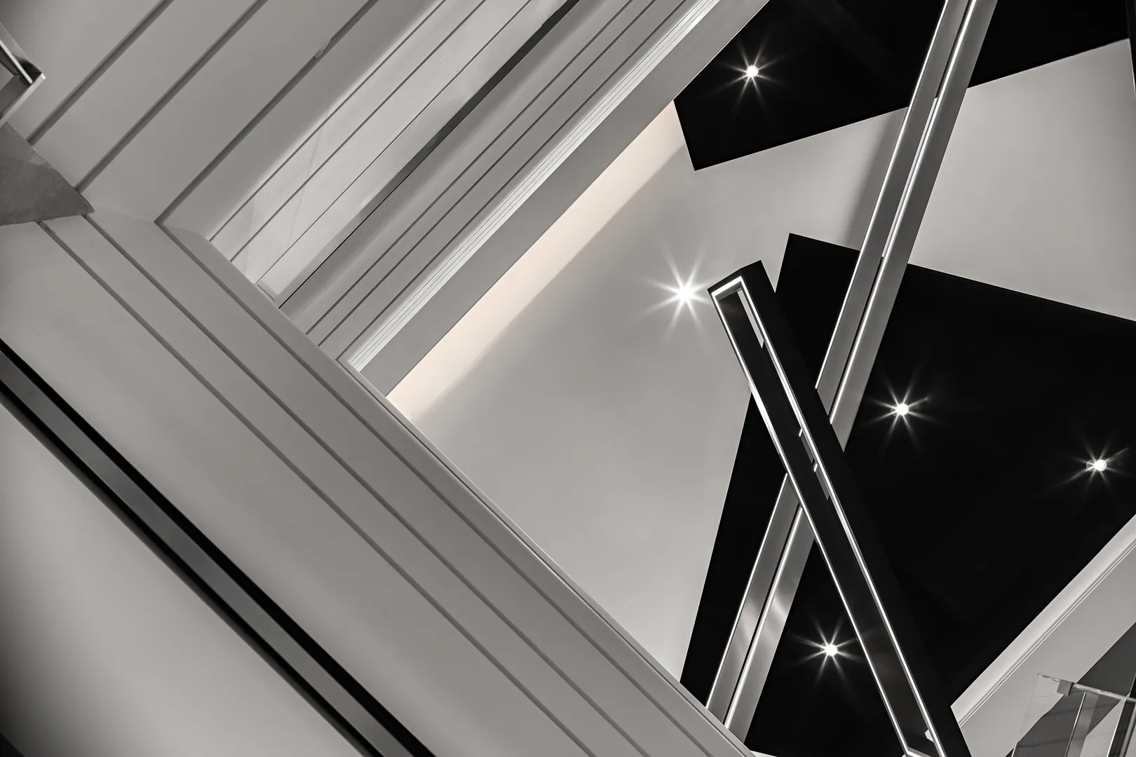 Modern indoor space featuring glass and metal architectural elements.