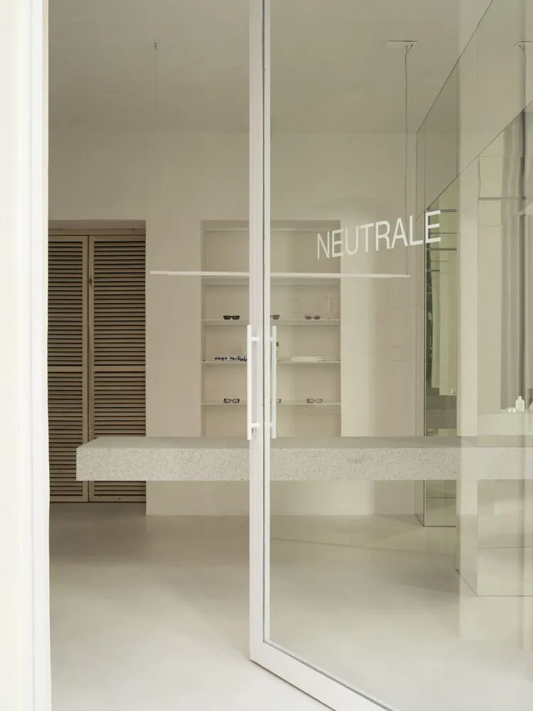 A minimalist shop with a terrazzo countertop.
