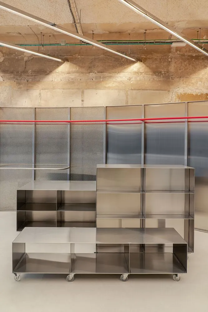 Industrial-style metal storage solution with multiple shelves on wheels.
