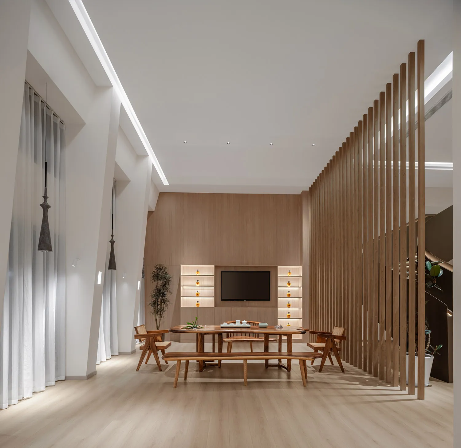 Modern minimalist living room with wood furniture and white walls.