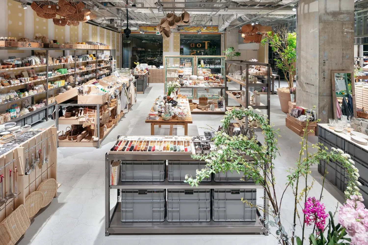 A retail interior with a metal rack and concrete flooring.