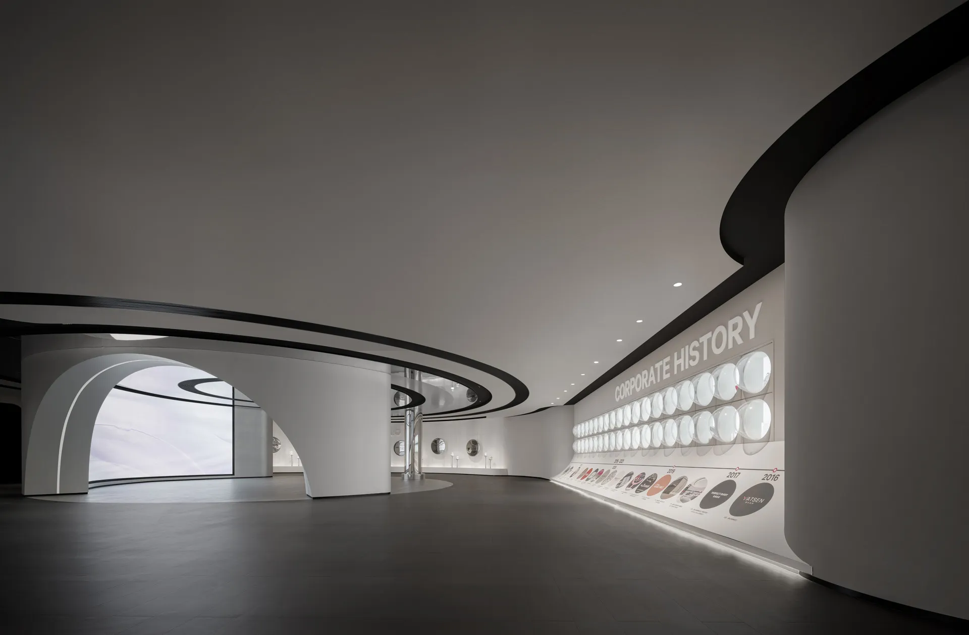 A modern lobby with a concrete floor and minimalist design.