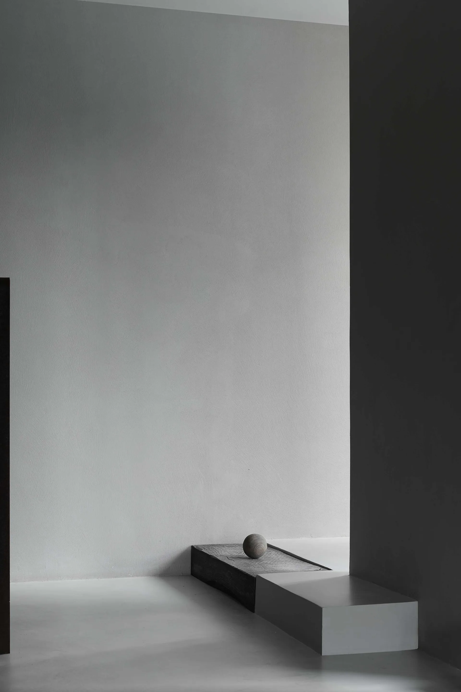A minimalist interior design featuring concrete elements