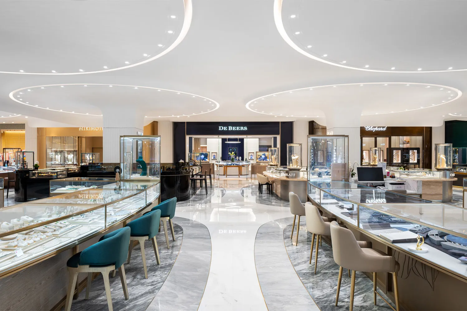 A modern retail jewelry store featuring marble and glass