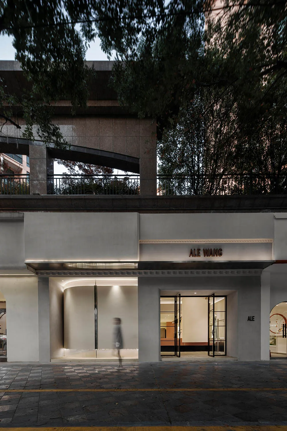 A modern retail storefront with large glass windows.