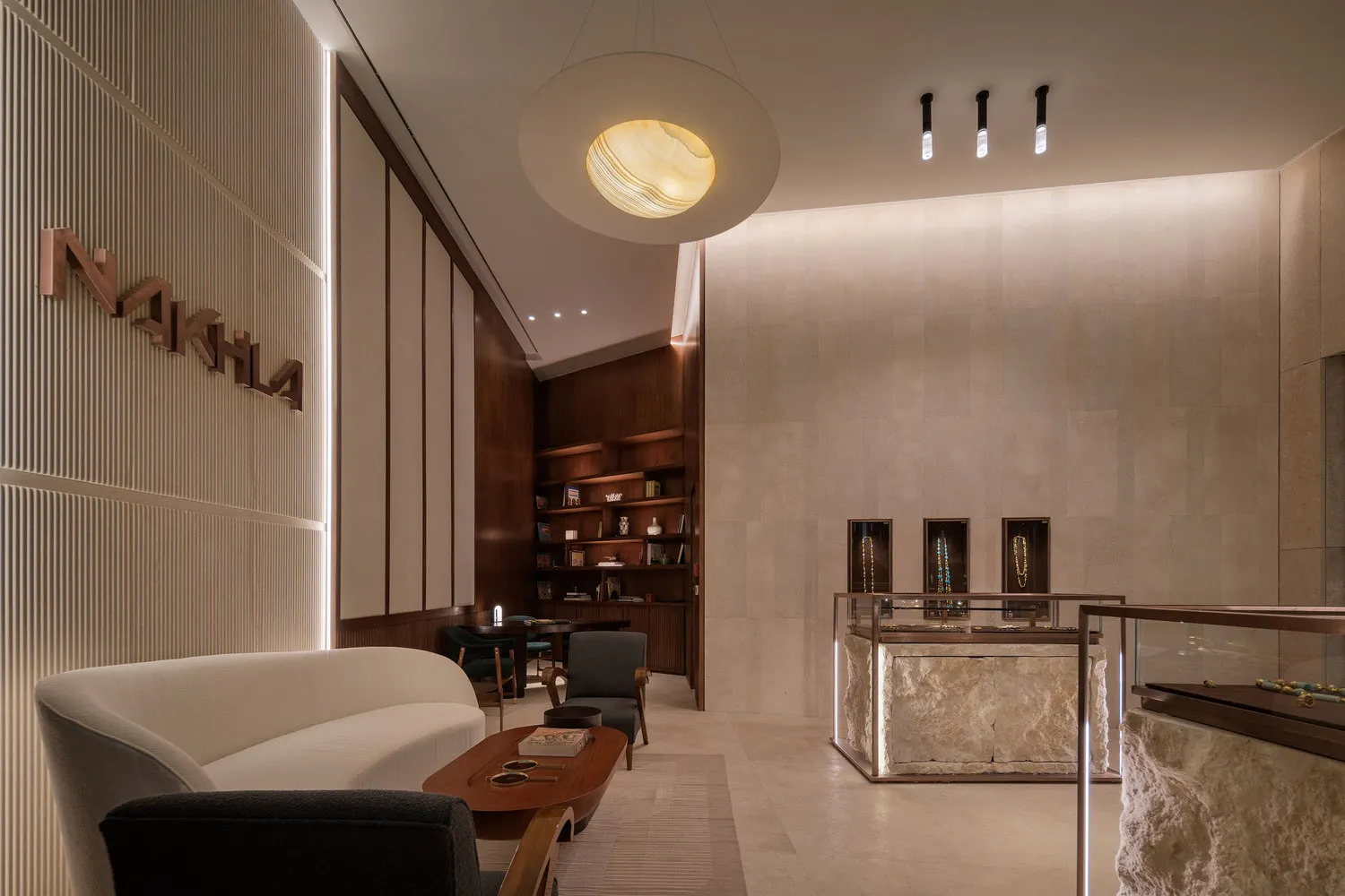 A modern retail storefront with marble and concrete materials.