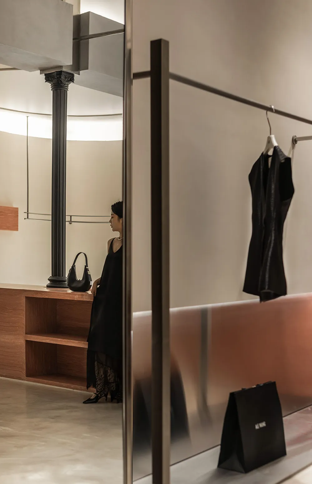 A modern retail store with transparent glass walls and a minimalist design.