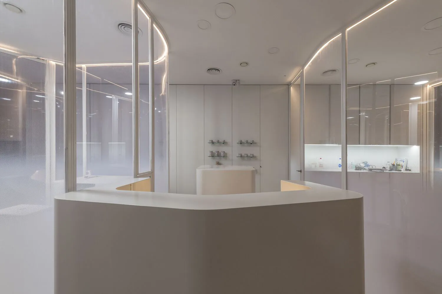 A minimalist office reception desk made of polished concrete.