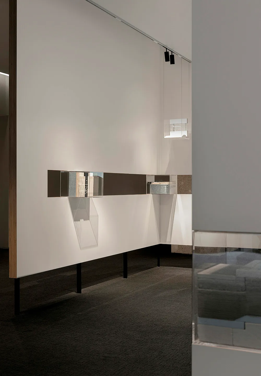 Modern interior design featuring materials like glass, wood, metal, and concrete.