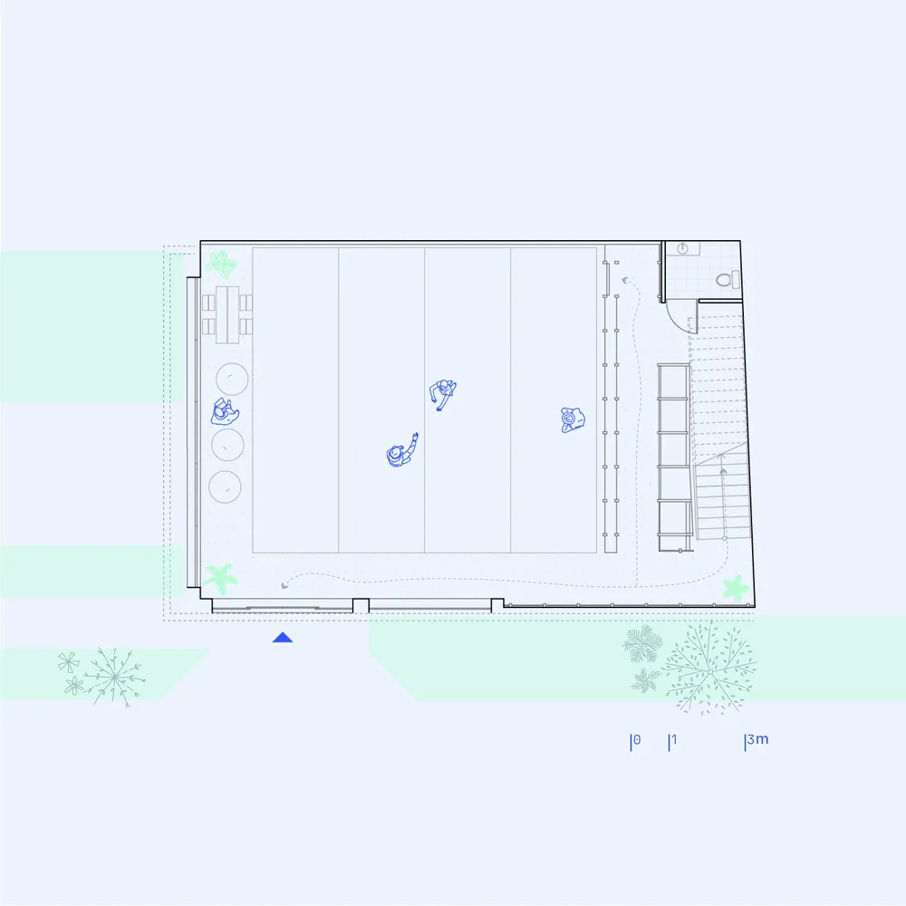 Floor plan of an office space, showing desks, chairs, and a staircase.