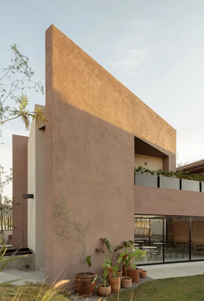 A modern residential interior featuring minimalistic design and concrete walls.