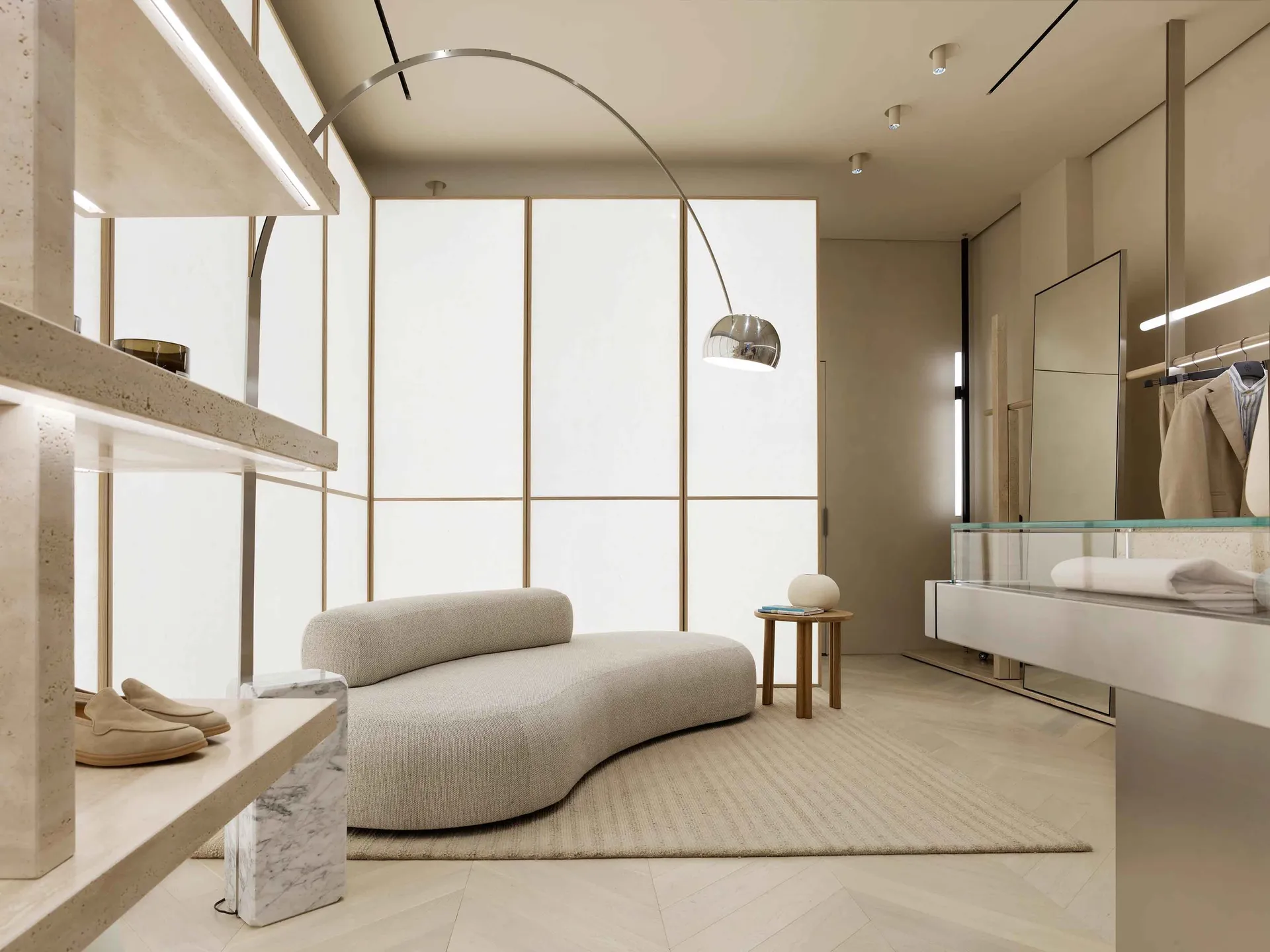 Modern minimalist living room with minimalist furniture, marble flooring, and contemporary design elements.