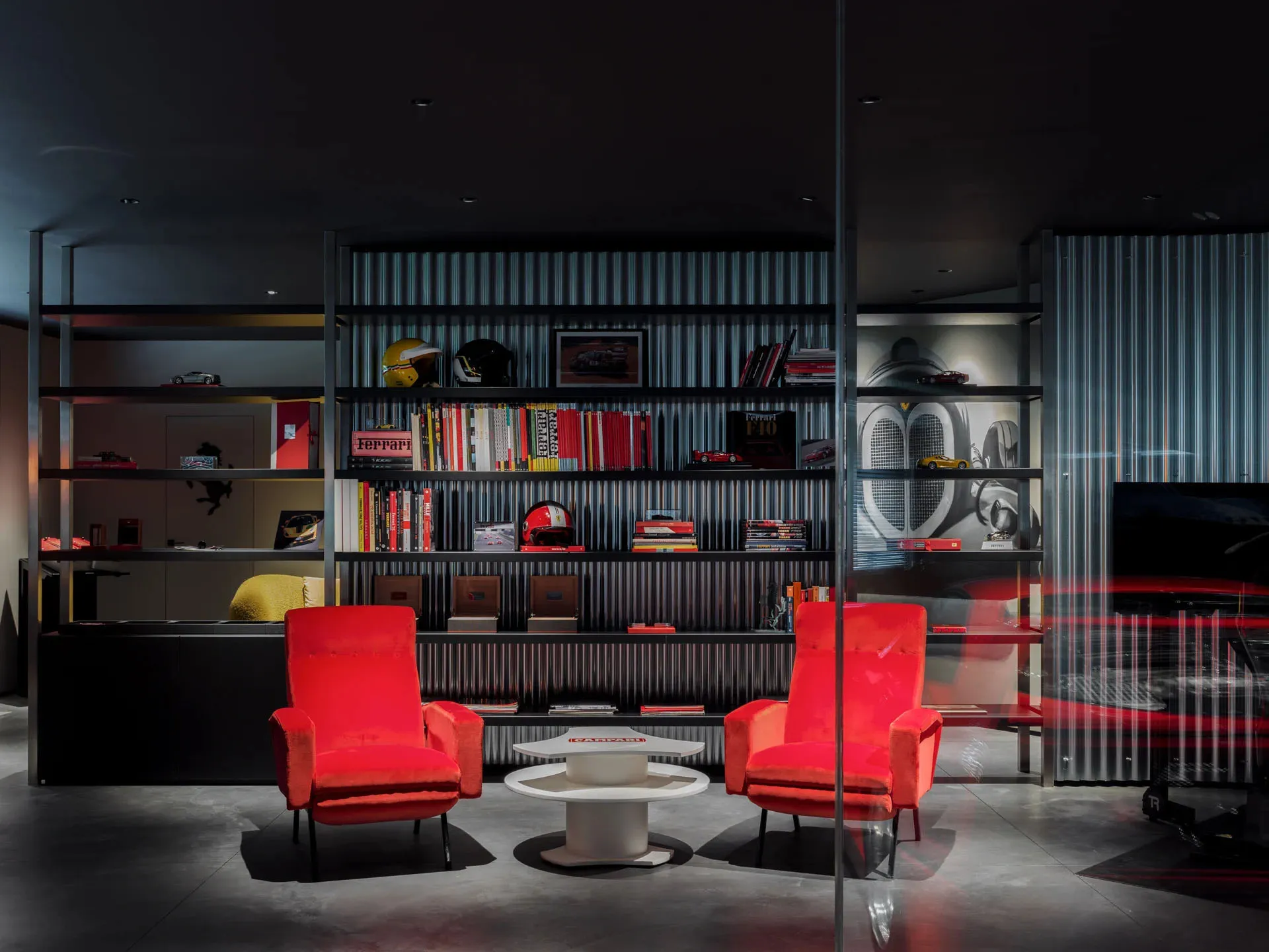 Modern office interior with metal shelves, wooden chairs, and glass partitions.