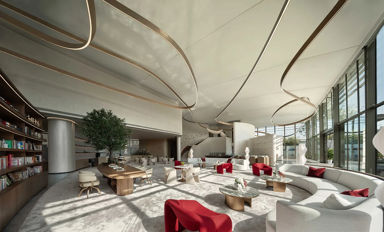 Modern hotel lobby with white furniture and glass walls