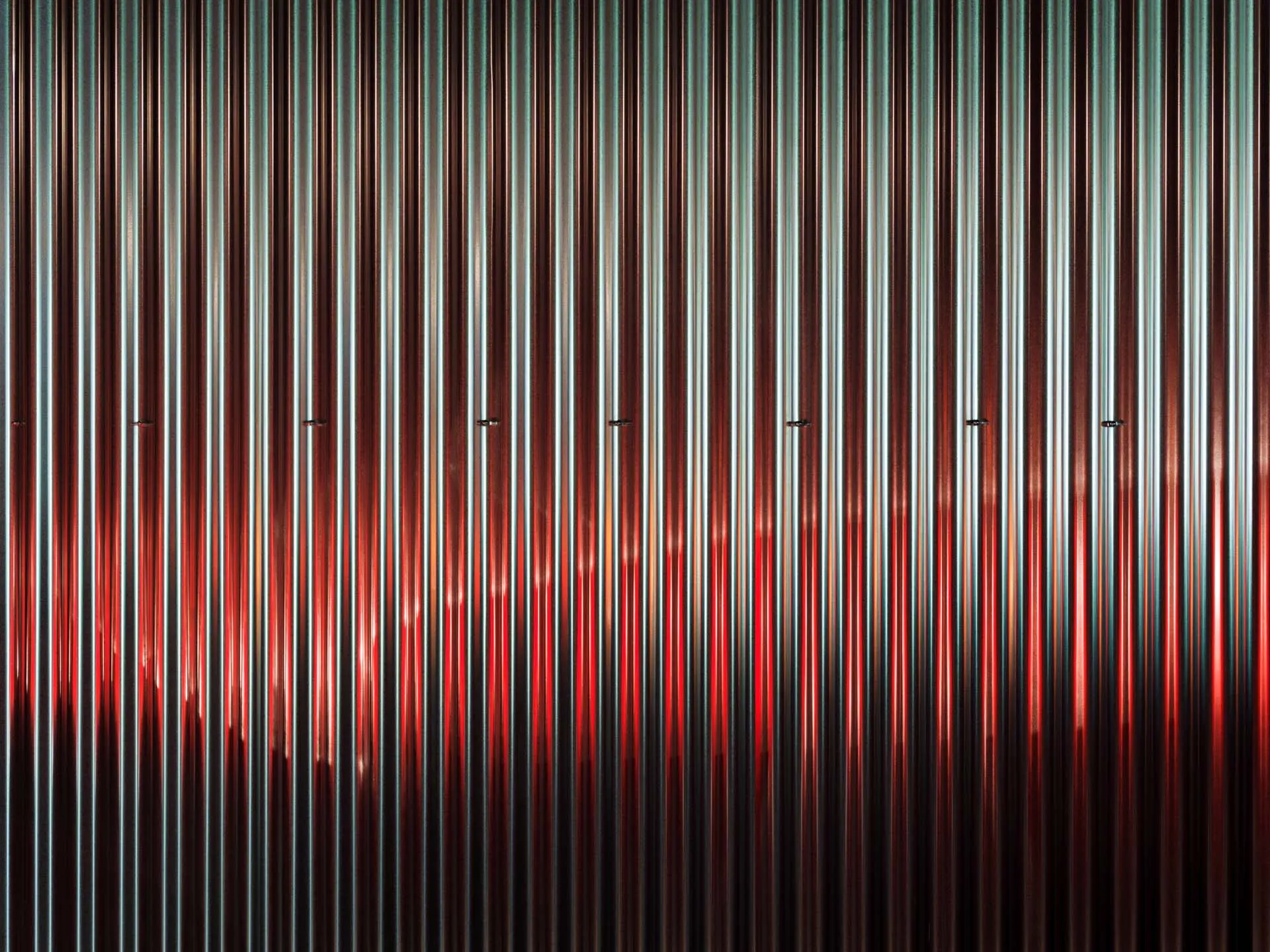 A vivid and dynamic abstract design featuring metallic hues and patterns.