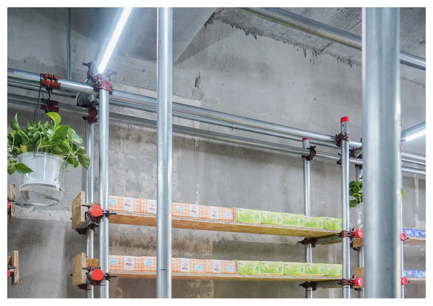 Industrial storage system with metal shelves and boxes.