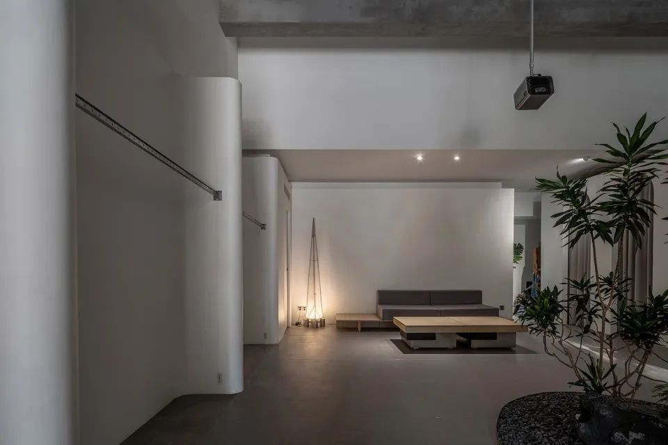 Minimalist interior design featuring concrete materials in a living space.