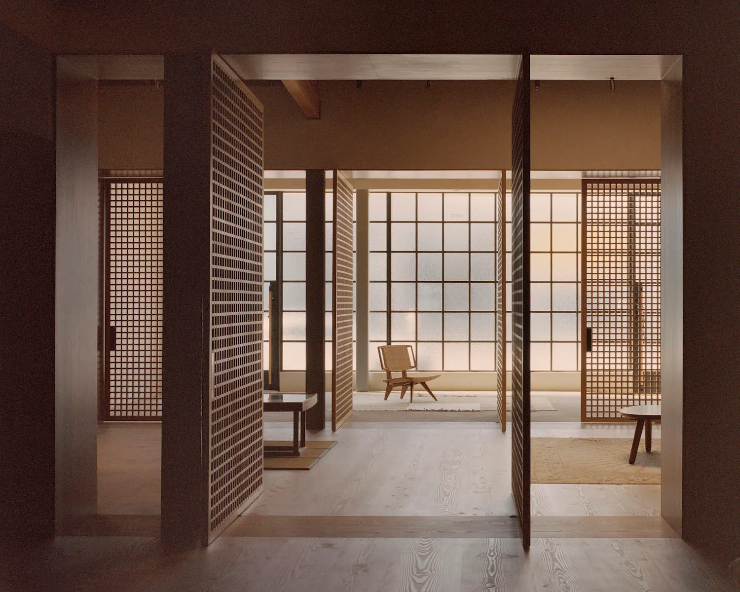 A minimalist residential interior featuring a cozy living space with wood paneling and a large glass window.