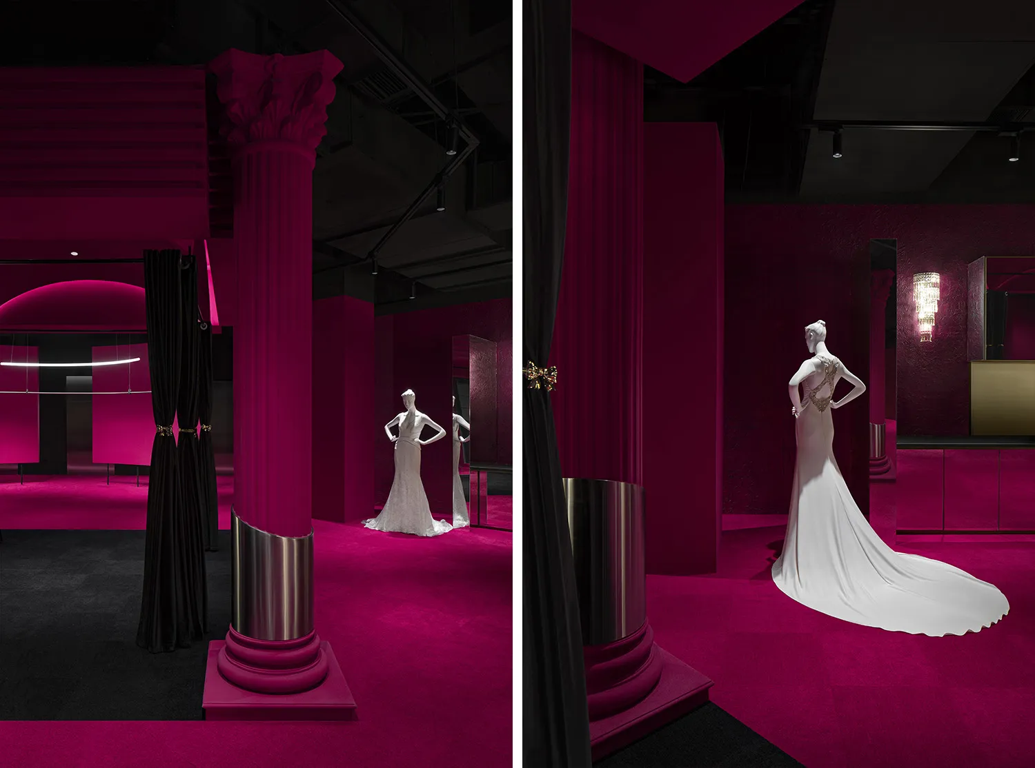 A pink exhibition space with a mannequin wearing a long white dress on a platform, surrounded by black curtains and a black c