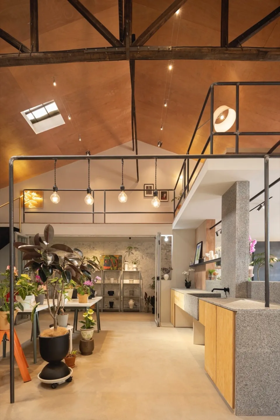 An industrial retail space featuring concrete walls and floors.
