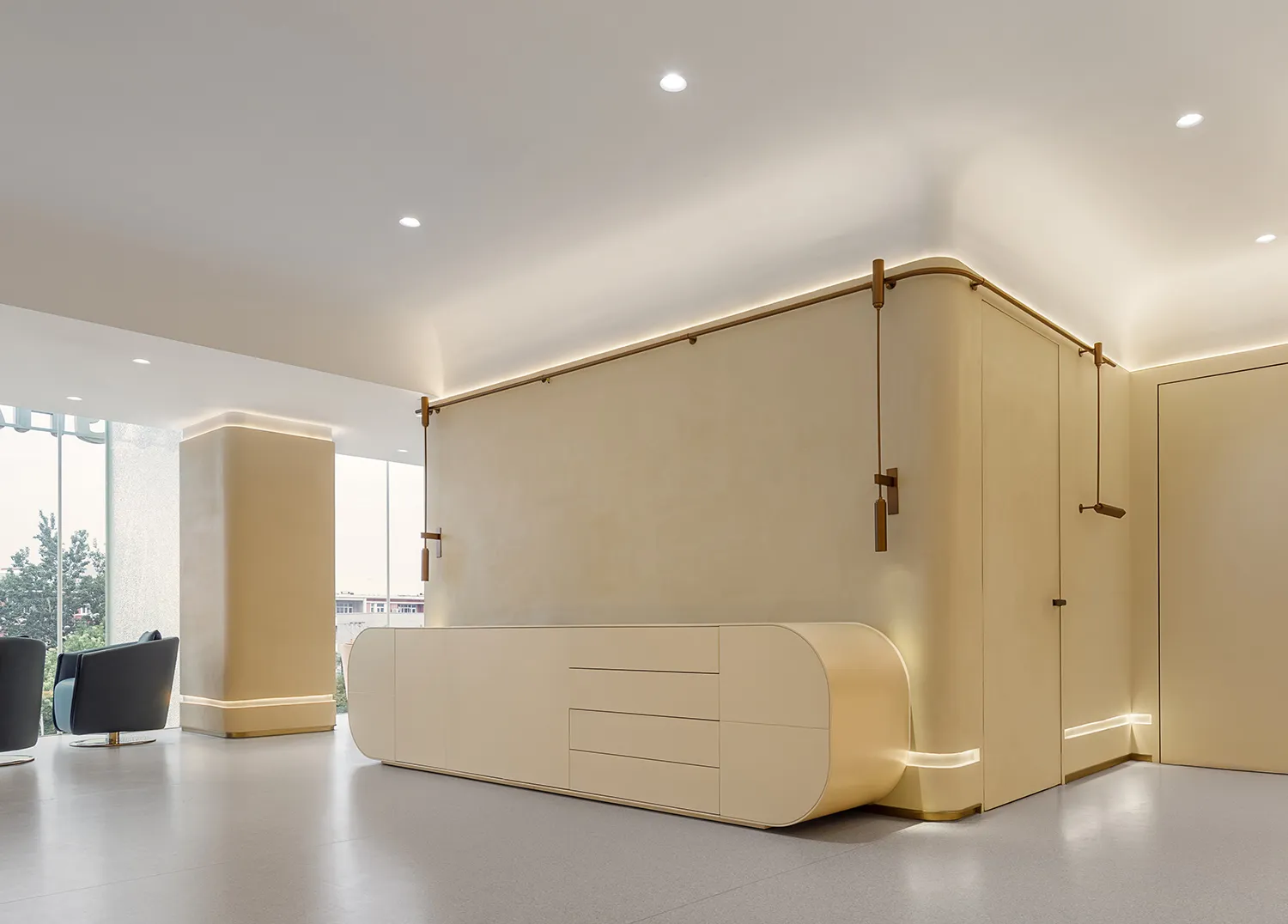Modern minimalist commercial office featuring a floating cabinet with concrete finish and wooden dowel handles, showcasing cl