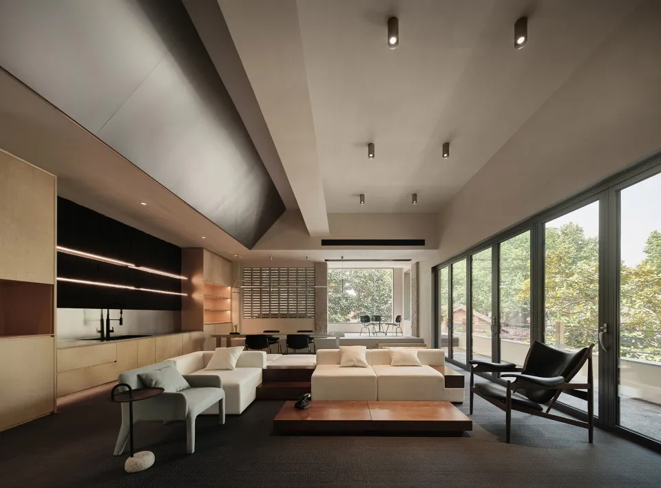 Modern, minimalist interior design featuring mixed materials in a contemporary condo setting