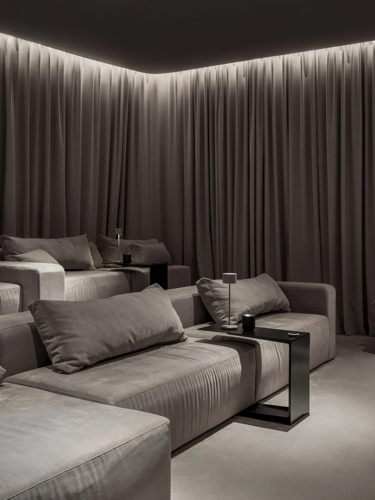 A modern living room with plush velvet sofas and minimalistic design