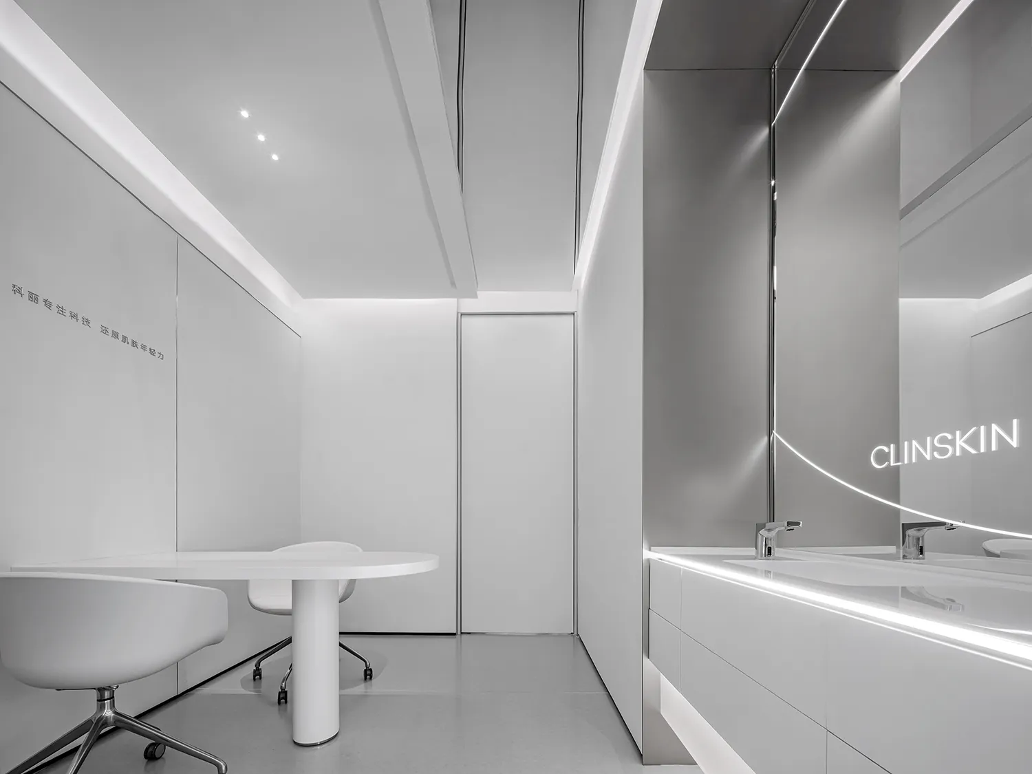 Modern office space with minimalistic design, featuring sleek white furniture and a white podium with a chair.