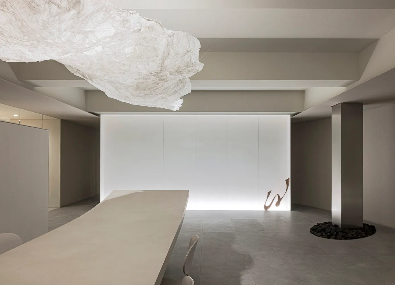 Modern minimalist interior design with concrete walls and ceiling.