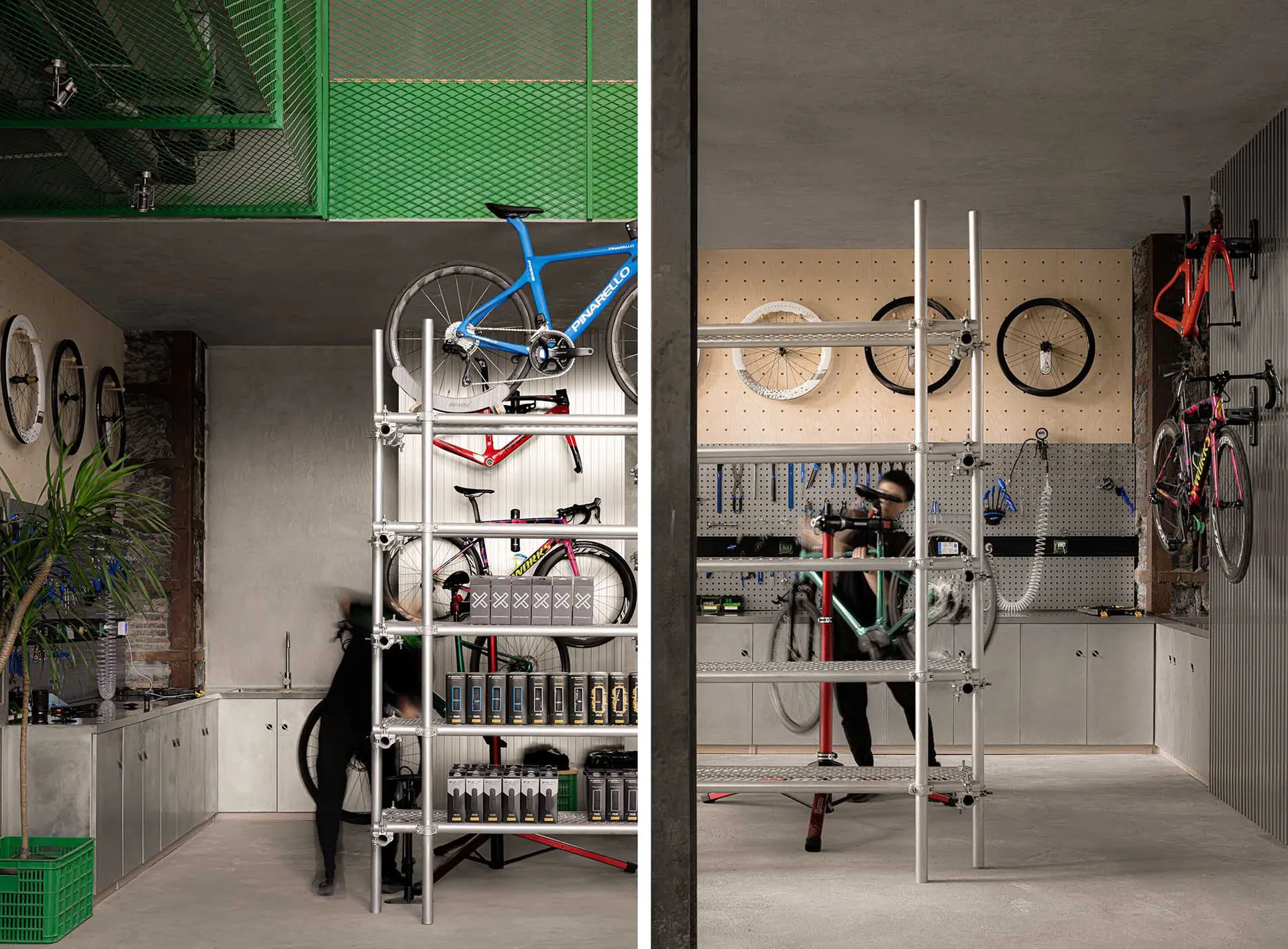 A workshop with metal shelves, bicycle parts, and people working on bikes.