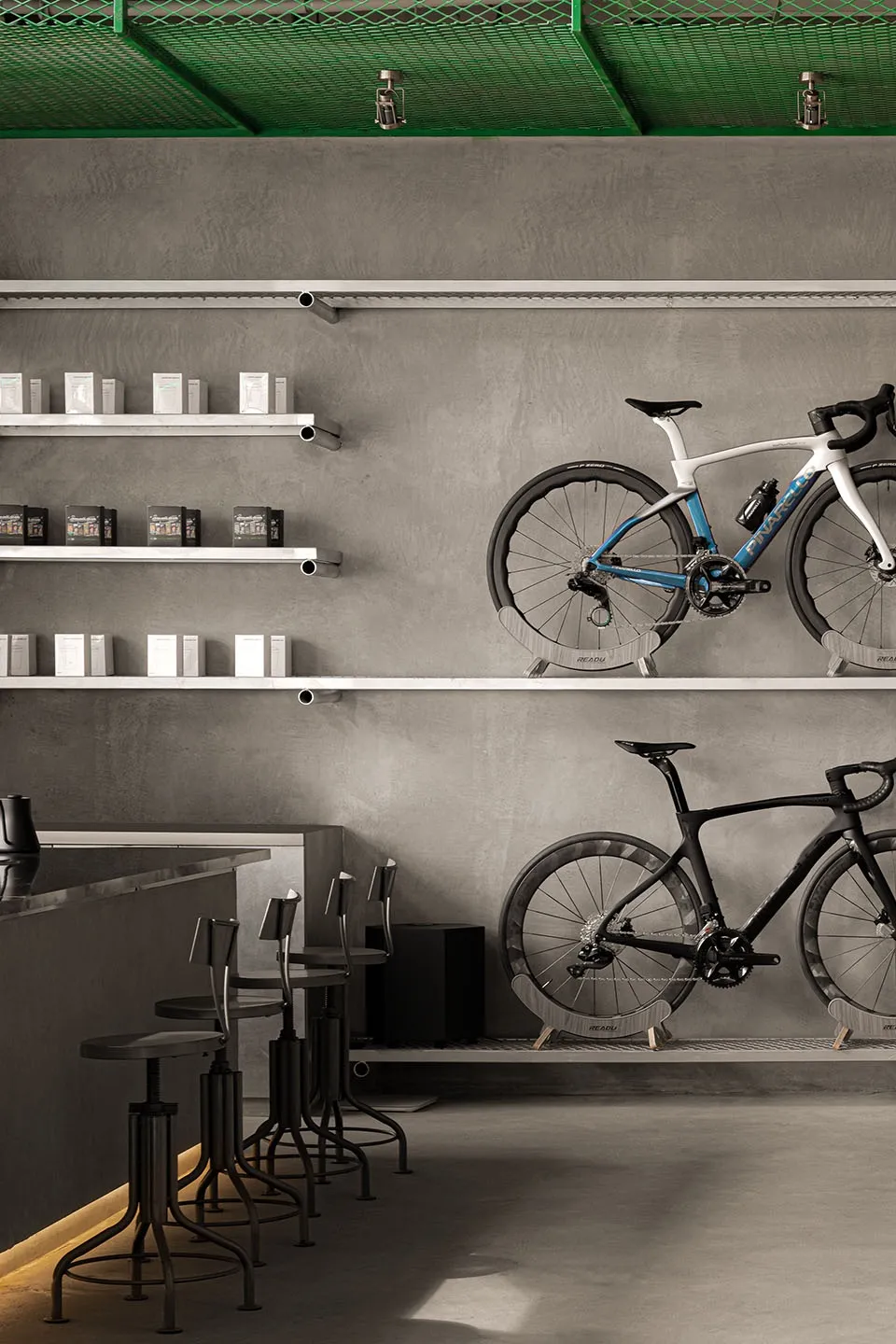 Minimalist interior design featuring a concrete counter, shelves with bicycles, and retail products.