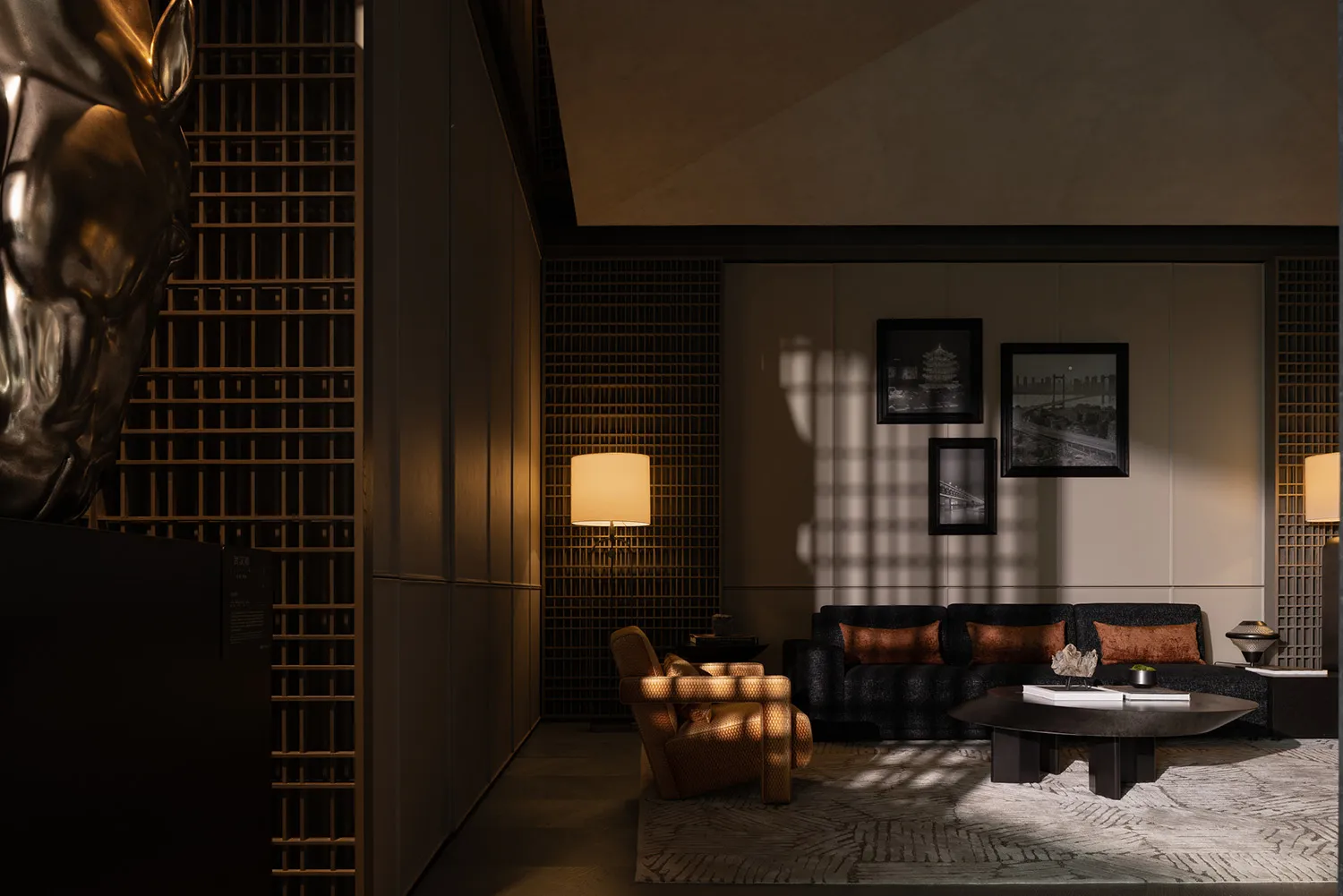 A modern residential living room with textured dark-colored panels on the walls and wooden furniture.