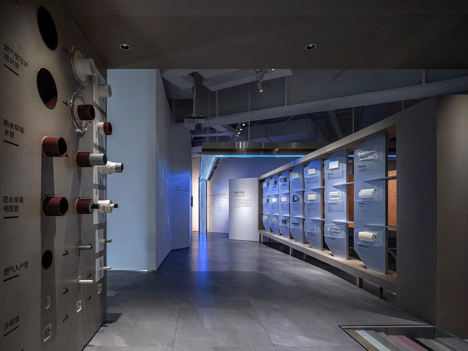 Modern exhibit hall with plastic shelves displaying various products.