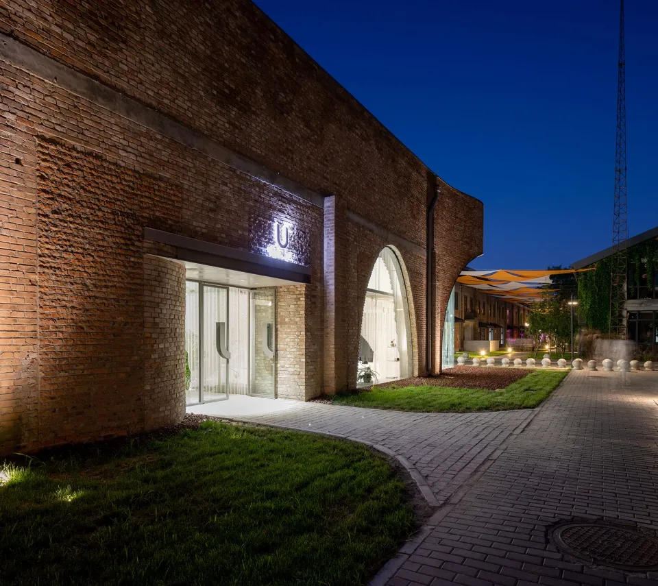 An industrial commercial interior with brick walls and a modern, open layout.