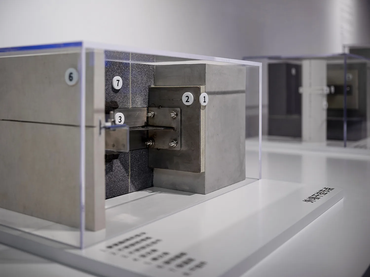 Modern exhibition featuring metal and concrete blocks